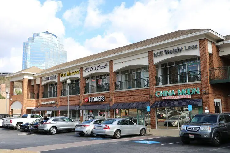 Multi-story retail building exterior with storefronts